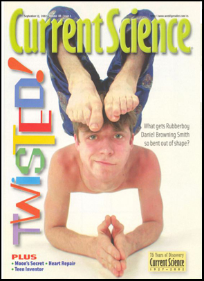 Daniel in a contortionist elbow stand on the cover of Current Science